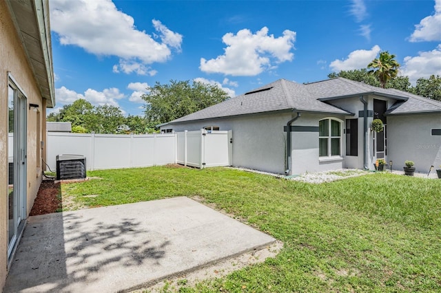 11022 Connacht Way, Tampa, FL 33610 - rear view of property with a patio, stucco siding, a fenced backyard, and roof with shingles