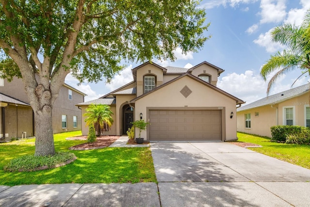 18508 Merseyside Loop, Land O Lakes, FL 34638 - view of front facade with an attached garage, a front yard, concrete driveway, and stucco siding