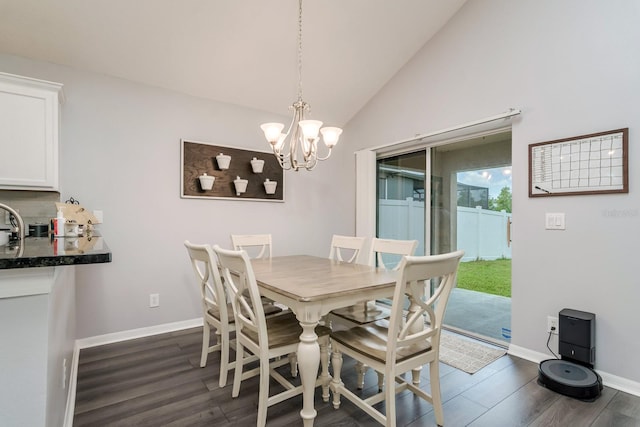 18508 Merseyside Loop, Land O Lakes, FL 34638 - dining space with dark wood-type flooring, a chandelier, and vaulted ceiling