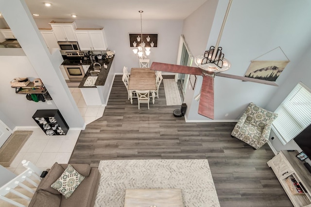 18508 Merseyside Loop, Land O Lakes, FL 34638 - living area with a chandelier, wood finished floors, and recessed lighting
