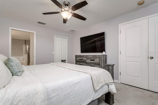 18508 Merseyside Loop, Land O Lakes, FL 34638 - bedroom with light carpet, connected bathroom, a ceiling fan, and a closet