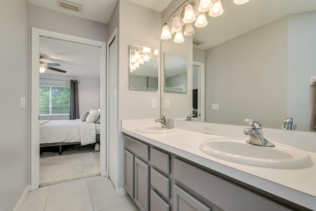 18508 Merseyside Loop, Land O Lakes, FL 34638 - ensuite bathroom with double vanity, tile patterned floors, and a ceiling fan