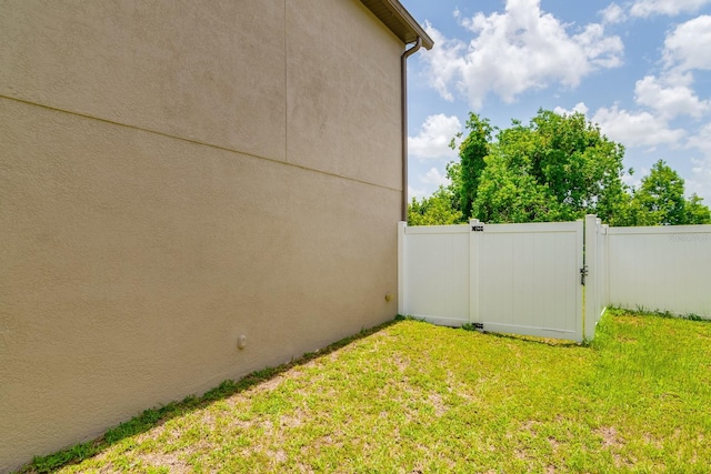 18508 Merseyside Loop, Land O Lakes, FL 34638 - view of yard featuring a gate
