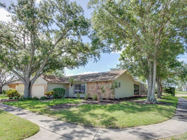 1610 Sanderling Ct, Brandon, FL 33511 - ranch-style house with a garage and a front lawn