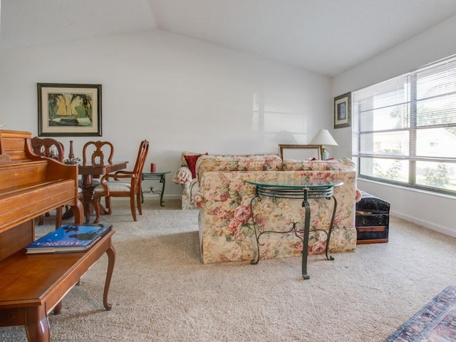 1610 Sanderling Ct, Brandon, FL 33511 - carpeted living room featuring vaulted ceiling and baseboards