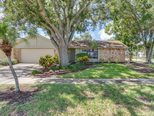 1610 Sanderling Ct, Brandon, FL 33511 - ranch-style house featuring stone siding, driveway, an attached garage, and a front yard