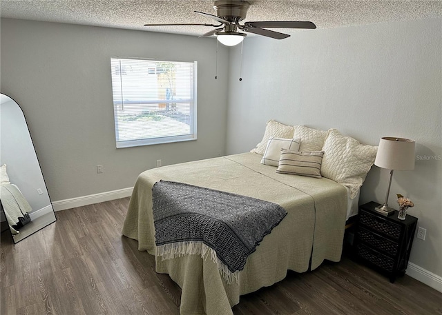 7301 Mitchell Ranch Rd, New Port Richey, FL 34655 - bedroom with wood finished floors, a textured ceiling, and a ceiling fan