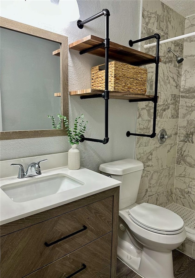 7301 Mitchell Ranch Rd, New Port Richey, FL 34655 - full bath with vanity, a stall shower, a textured wall, and a textured ceiling