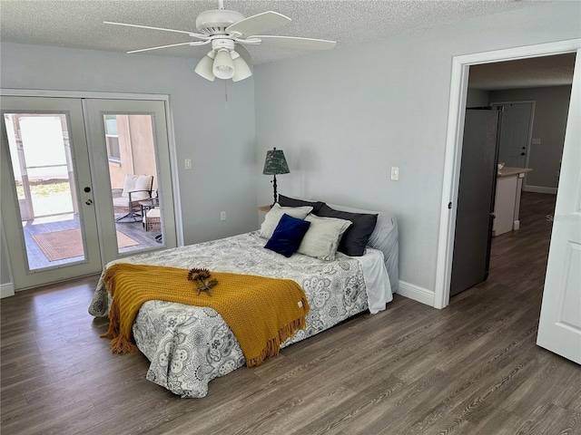7301 Mitchell Ranch Rd, New Port Richey, FL 34655 - bedroom featuring access to outside, wood finished floors, french doors, a textured ceiling, and a ceiling fan