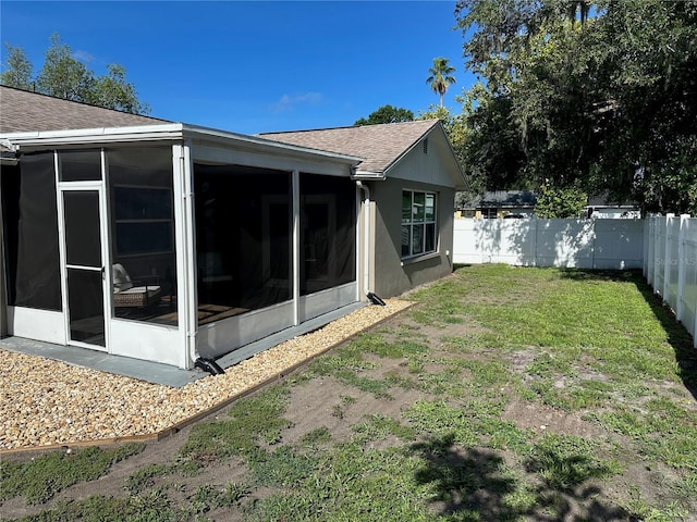7301 Mitchell Ranch Rd, New Port Richey, FL 34655 - fenced backyard featuring a sunroom