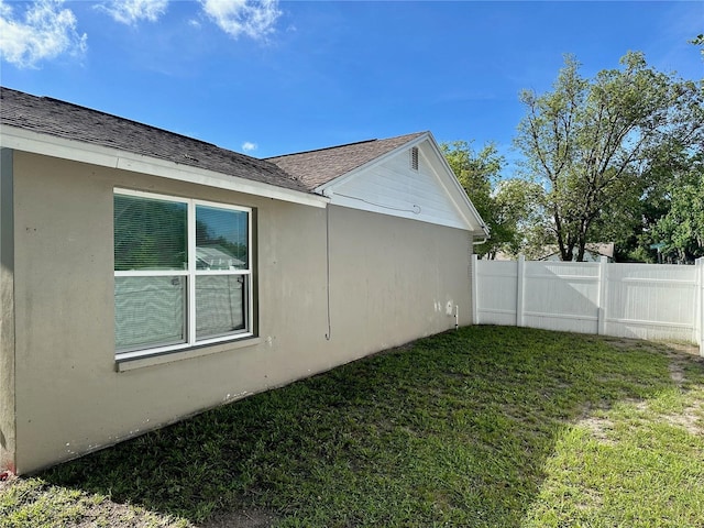 7301 Mitchell Ranch Rd, New Port Richey, FL 34655 - view of side of home with a shingled roof