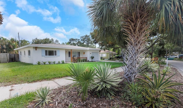 245 Grove Cir N, Dunedin, FL 34698 - single story home featuring stucco siding and an attached garage
