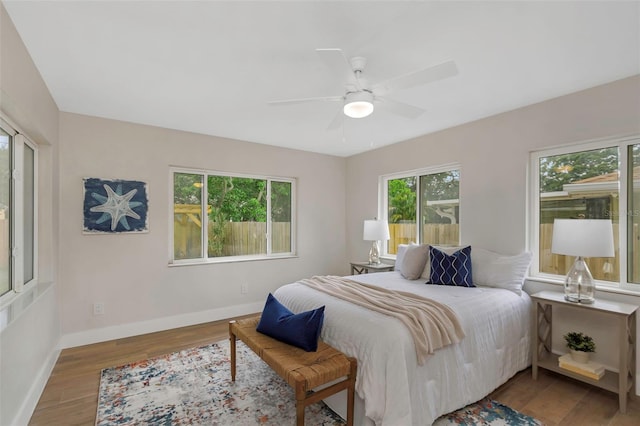245 Grove Cir N, Dunedin, FL 34698 - bedroom featuring wood finished floors and a ceiling fan