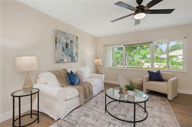 245 Grove Cir N, Dunedin, FL 34698 - living area with wood finished floors and ceiling fan