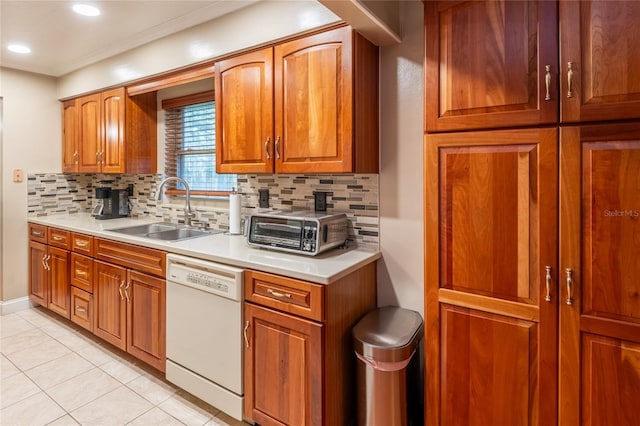 616 Pawn Way, Seffner, FL 33584 - kitchen featuring dishwasher, brown cabinetry, tasteful backsplash, light countertops, and crown molding
