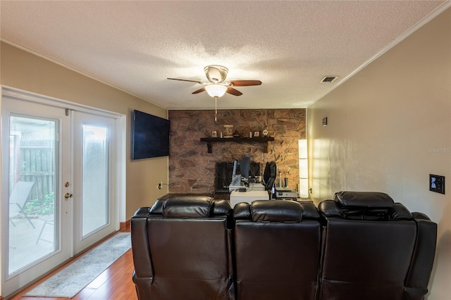 616 Pawn Way, Seffner, FL 33584 - living room with ceiling fan, wood finished floors, a textured ceiling, and ornamental molding