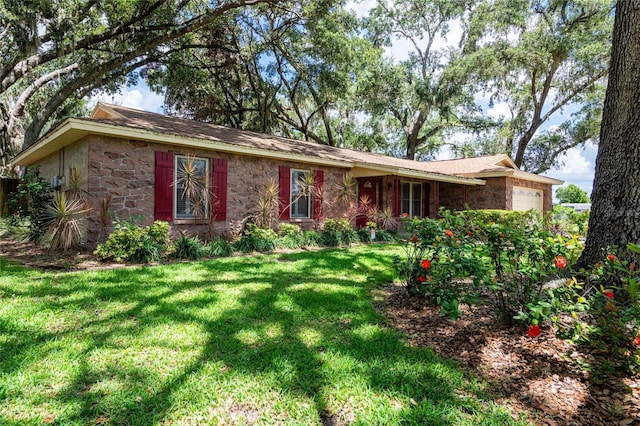 616 Pawn Way, Seffner, FL 33584 - single story home featuring an attached garage, stone siding, and a front lawn