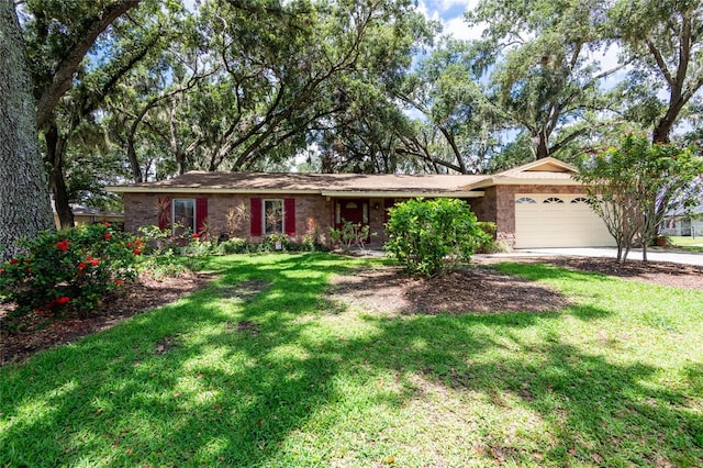616 Pawn Way, Seffner, FL 33584 - ranch-style house with a garage, a front lawn, and driveway