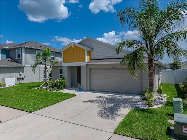 12931 Twin Bridges Dr, Riverview, FL 33579 - view of front of home with an attached garage, driveway, stucco siding, and board and batten siding
