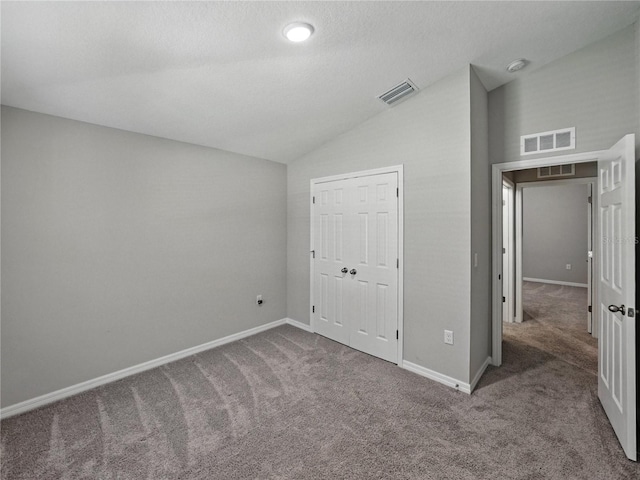12931 Twin Bridges Dr, Riverview, FL 33579 - unfurnished bedroom with vaulted ceiling, carpet, and a closet