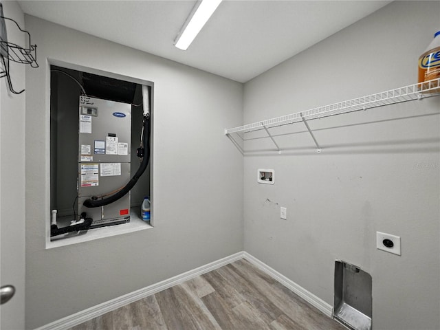 12931 Twin Bridges Dr, Riverview, FL 33579 - laundry room with wood finished floors, electric dryer hookup, and hookup for a washing machine