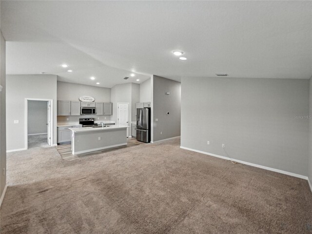 12931 Twin Bridges Dr, Riverview, FL 33579 - unfurnished living room featuring light colored carpet, recessed lighting, and lofted ceiling