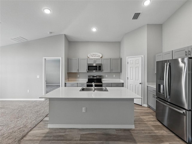 12931 Twin Bridges Dr, Riverview, FL 33579 - kitchen with stainless steel appliances, gray cabinets, light countertops, a center island with sink, and recessed lighting