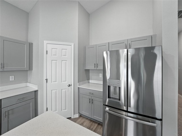 12931 Twin Bridges Dr, Riverview, FL 33579 - kitchen with stainless steel refrigerator with ice dispenser, gray cabinets, light countertops, and dark wood-style flooring