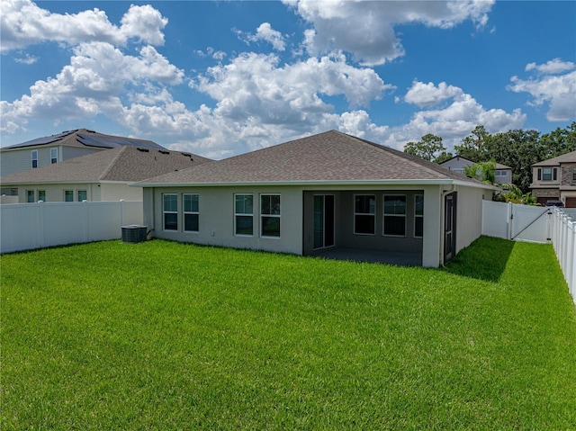 12931 Twin Bridges Dr, Riverview, FL 33579 - back of property with a fenced backyard, stucco siding, roof with shingles, and a gate
