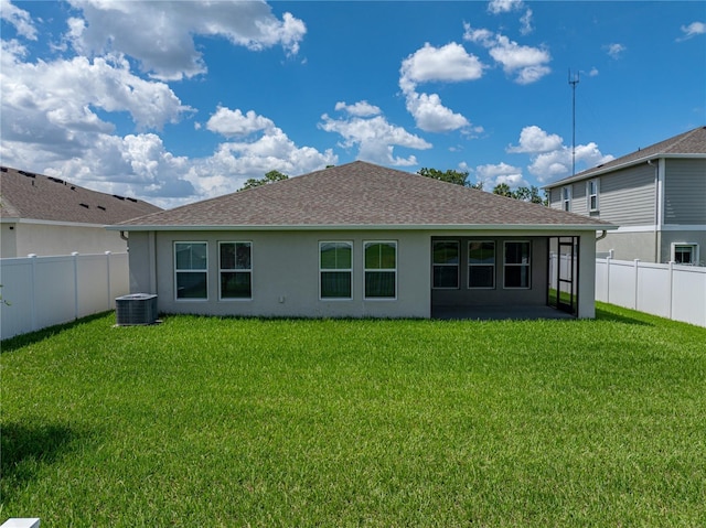 12931 Twin Bridges Dr, Riverview, FL 33579 - back of house with stucco siding, a fenced backyard, and roof with shingles