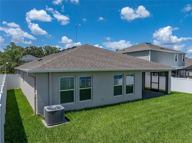 12931 Twin Bridges Dr, Riverview, FL 33579 - rear view of house featuring a fenced backyard, roof with shingles, and stucco siding