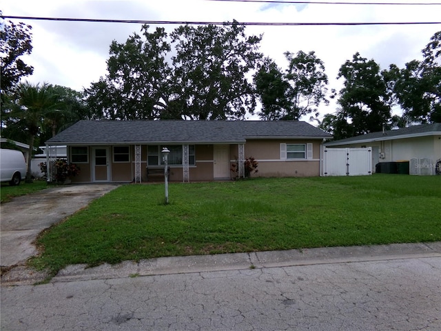 2239 Curtis Dr S, Clearwater, FL 33764 - ranch-style house featuring concrete driveway, stucco siding, a porch, and a gate