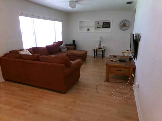 2239 Curtis Dr S, Clearwater, FL 33764 - living area with light wood-type flooring and built in shelves