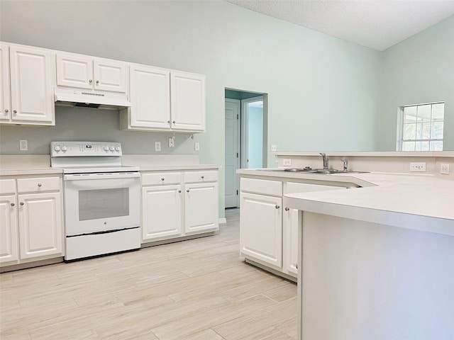 1990 Eclipse Dr, Middleburg, FL 32068 - kitchen featuring white range with electric cooktop, under cabinet range hood, light countertops, and white cabinets
