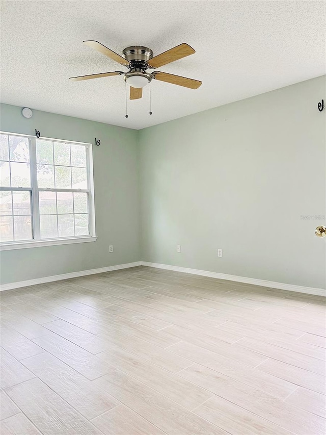 1990 Eclipse Dr, Middleburg, FL 32068 - spare room with a ceiling fan and a textured ceiling
