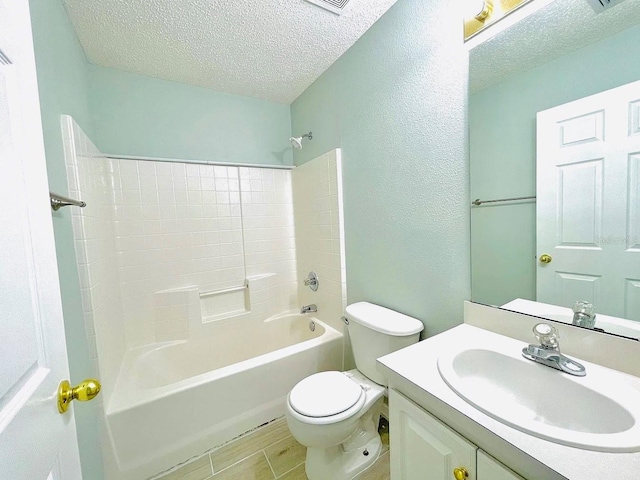 1990 Eclipse Dr, Middleburg, FL 32068 - bathroom featuring a textured ceiling, vanity, shower / bathtub combination, and a textured wall