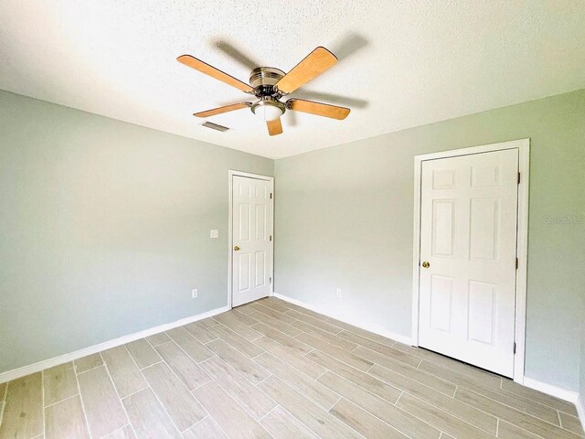 1990 Eclipse Dr, Middleburg, FL 32068 - spare room with a ceiling fan and light wood-type flooring