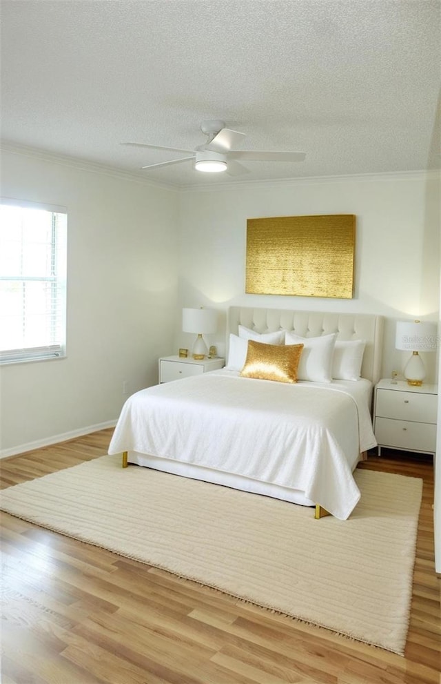 6144 Elmhurst Dr, New Port Richey, FL 34653 - bedroom with crown molding, a textured ceiling, wood finished floors, and ceiling fan