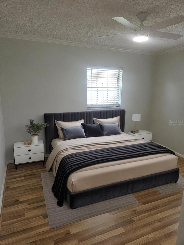 6144 Elmhurst Dr, New Port Richey, FL 34653 - bedroom with a textured ceiling, crown molding, wood finished floors, and a ceiling fan