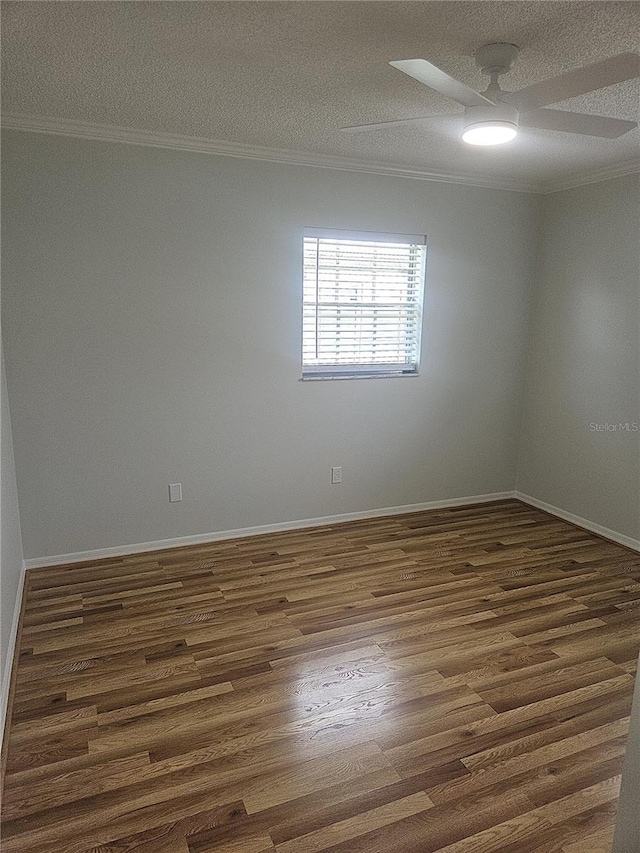 6144 Elmhurst Dr, New Port Richey, FL 34653 - empty room featuring crown molding, ceiling fan, a textured ceiling, and dark wood-style flooring