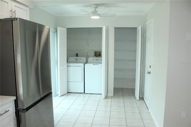 6144 Elmhurst Dr, New Port Richey, FL 34653 - washroom with crown molding, ceiling fan, washer and clothes dryer, and light tile patterned floors