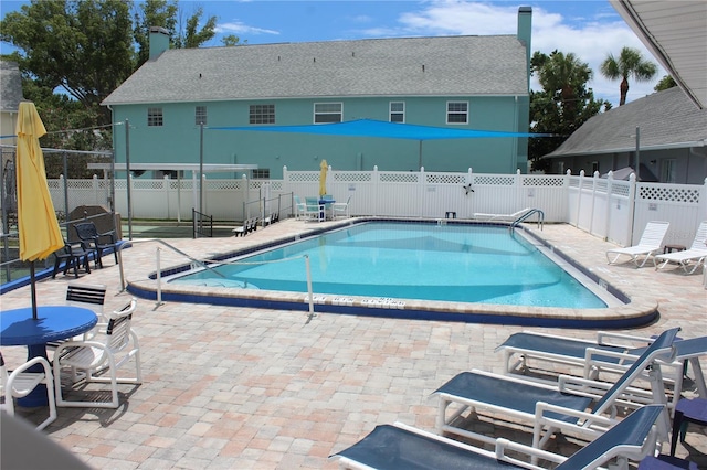 6144 Elmhurst Dr, New Port Richey, FL 34653 - community pool with a patio area