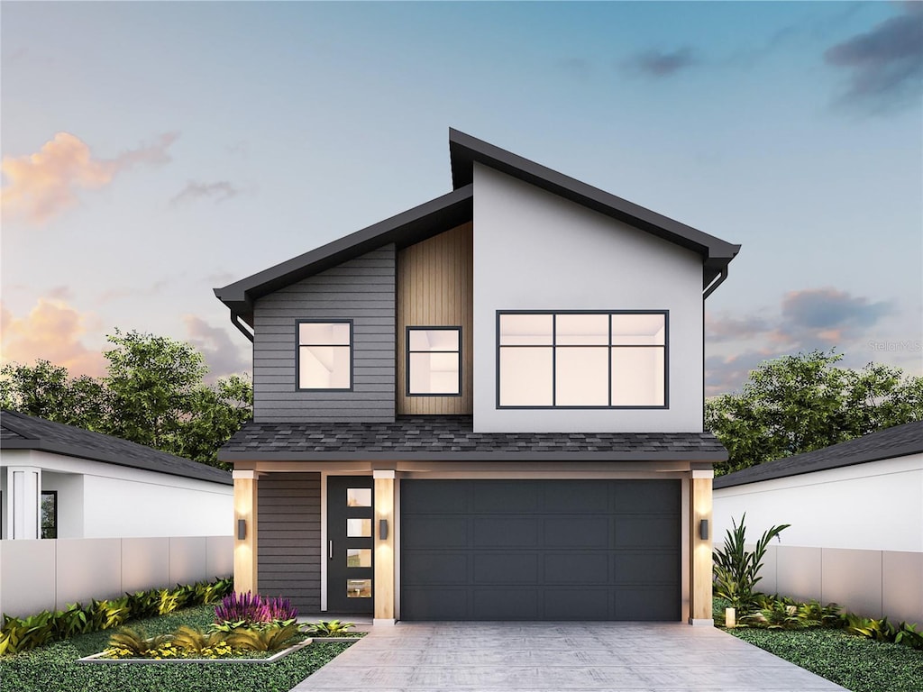 12236 Land St, Largo, FL 33773 - contemporary home with an attached garage, driveway, and a shingled roof