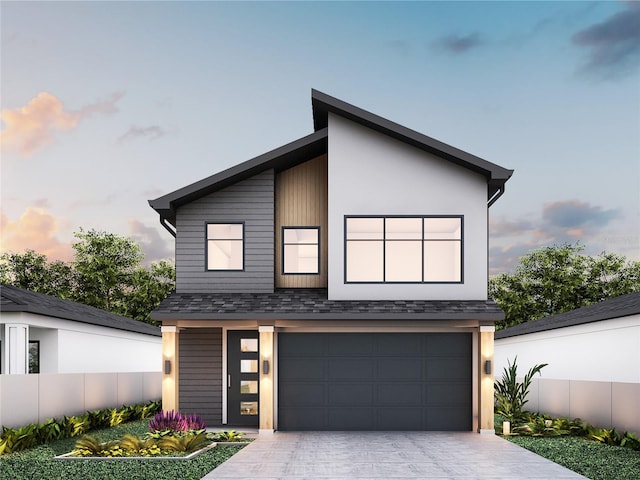12236 Land St, Largo, FL 33773 - contemporary home with an attached garage, driveway, and a shingled roof