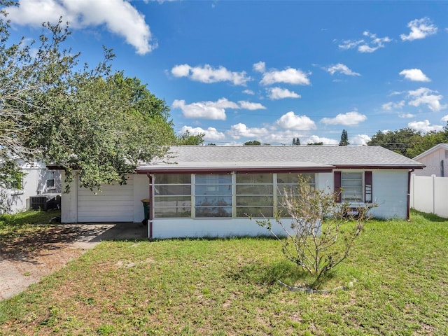 4911 Bartelt Rd, Holiday, FL 34690 - view of front of house featuring a sunroom and concrete block siding