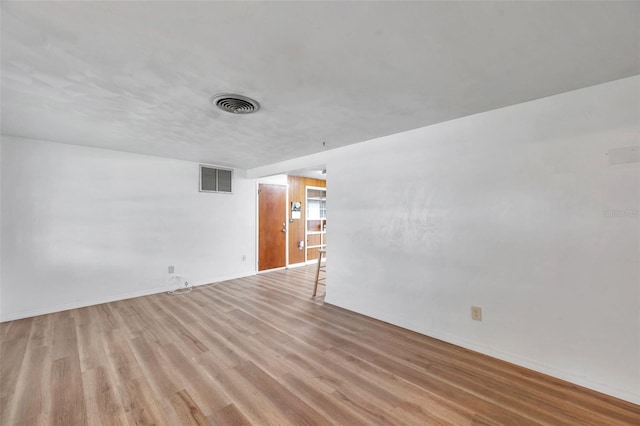 4911 Bartelt Rd, Holiday, FL 34690 - empty room with light wood-style floors