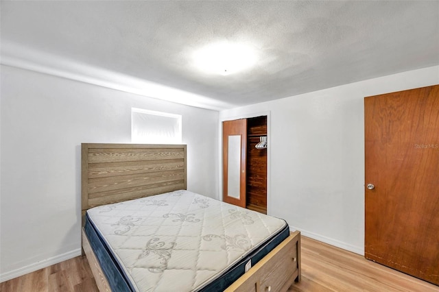 4911 Bartelt Rd, Holiday, FL 34690 - bedroom with light wood finished floors and a closet