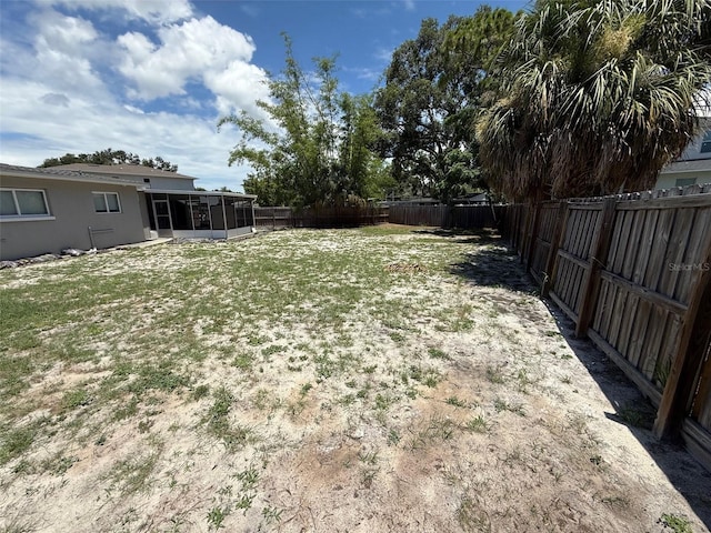 2907 W Elrod Ave, Tampa, FL 33611 - fenced backyard featuring a sunroom