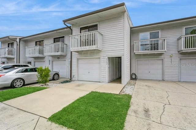 6263 93rd Ter N Unit 4202, Pinellas Park, FL 33782 - view of property featuring a garage and driveway