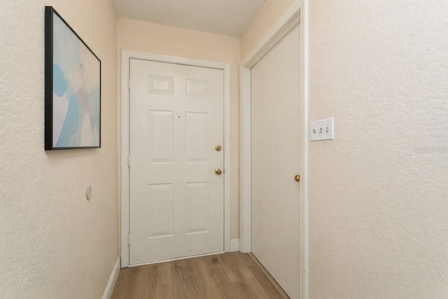 6263 93rd Ter N Unit 4202, Pinellas Park, FL 33782 - entryway featuring wood finished floors and a textured wall
